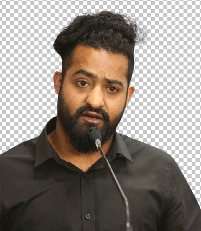 Jr. Ntr with long hair speaking on a mike transparent image