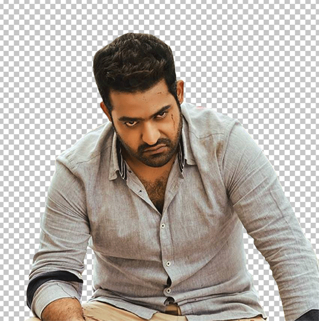 JrNtr angry expression while sitting wearing grey shirt transparent image