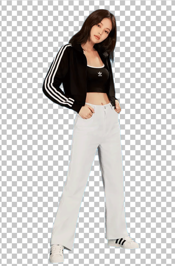Jennie Kim Standing, wearing a black and white tracksuit and white jeans png image