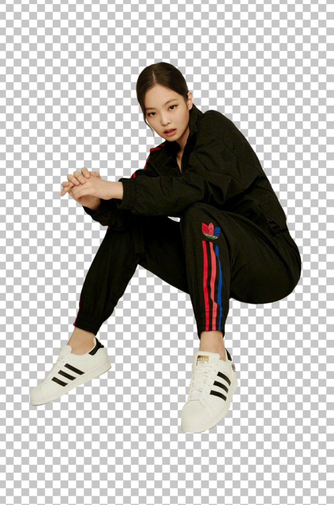 Jennie Kim wearing a black and red tracksuit with white sneakers png image
