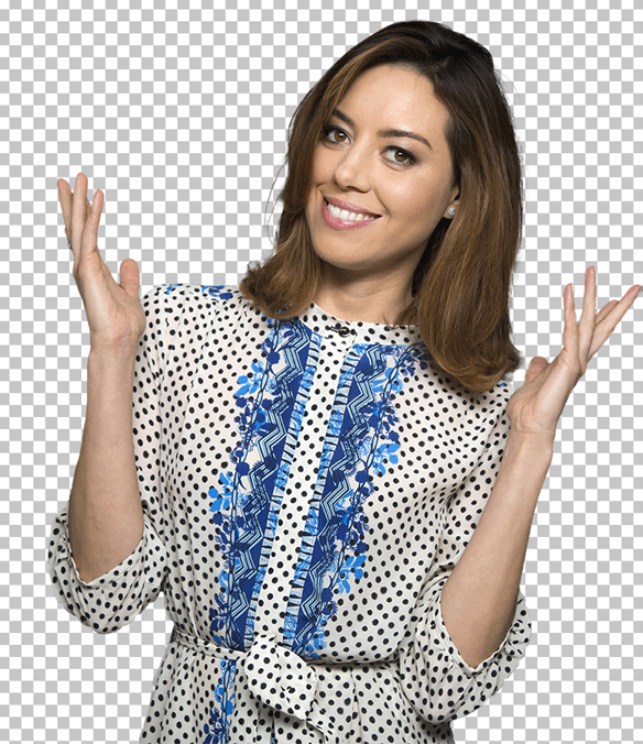 Aubrey Plaza Smiling and wearing a polka dot dress and holding her hands up in the air PNG image