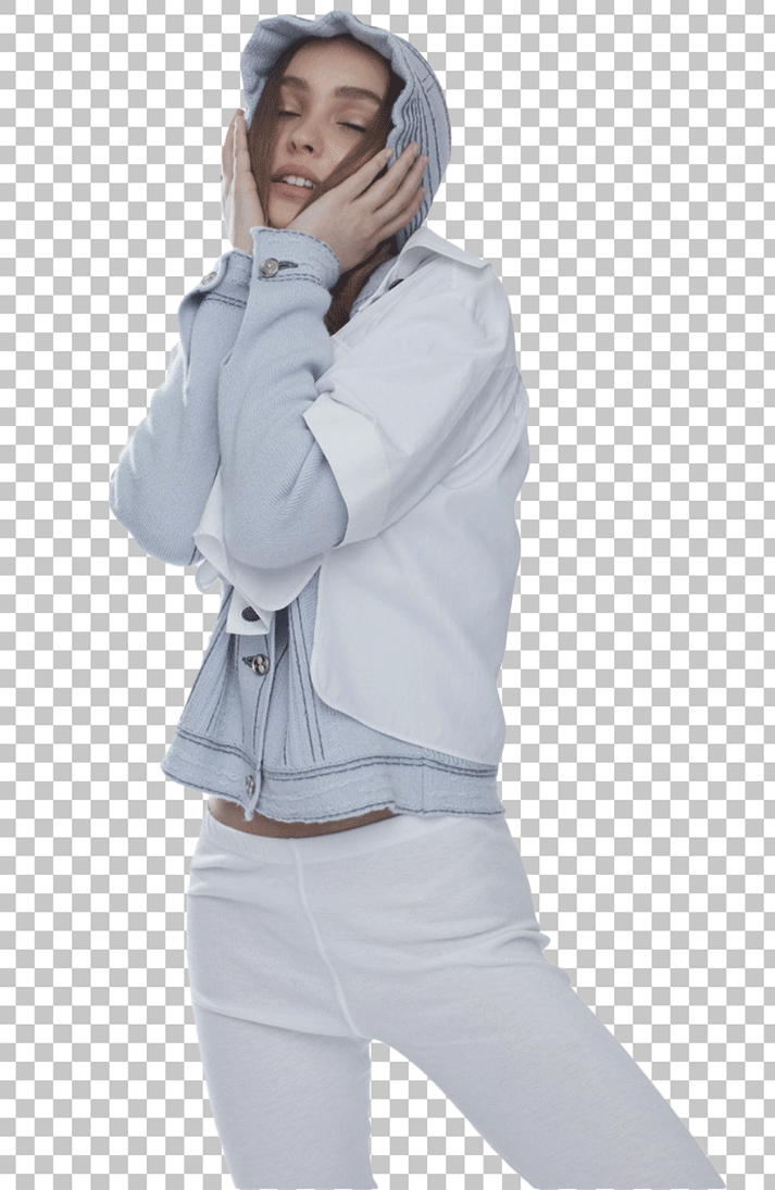Lily-Rose Depp standing in white hoodie and pants, with her hands on her face and her eyes closed PNG Image