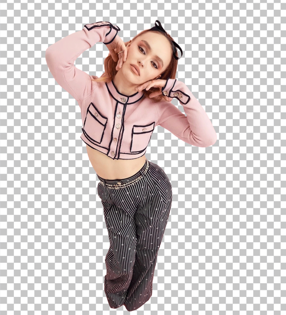 Lily Rose Depp is wearing a pink top and black pants, with her hands on her face PNG Image