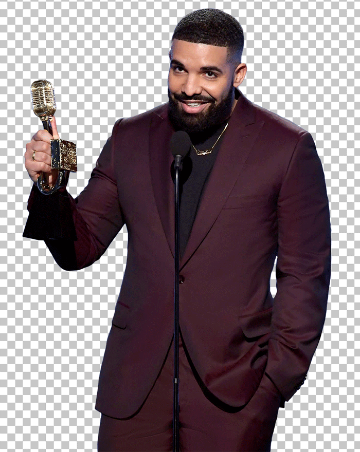 Drake in a red suit holding an award in his hand and speaking on the mike