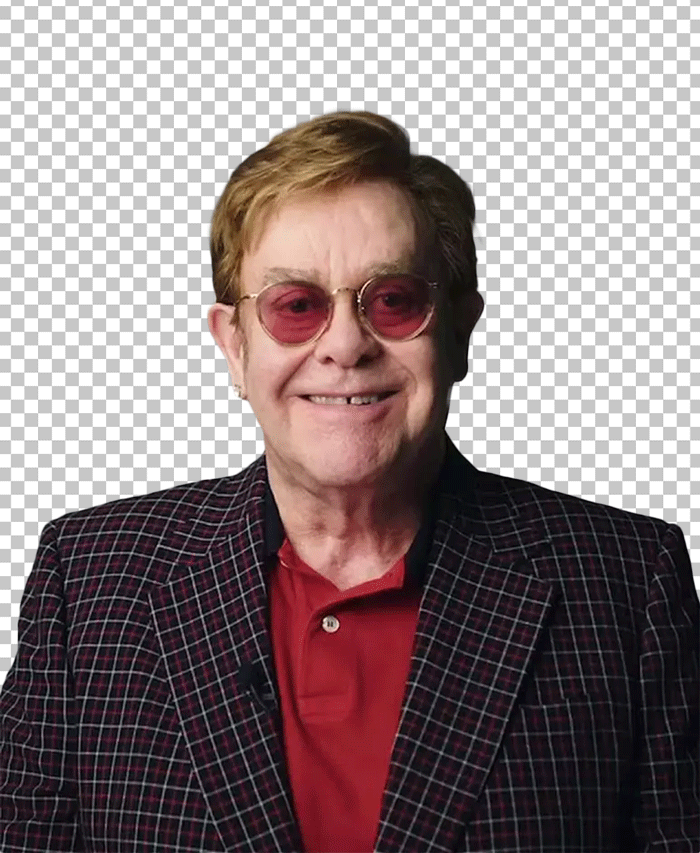 Elton John smiling and wearing sunglasses
