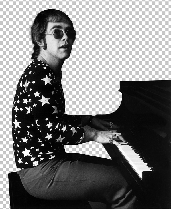 Black and white image of Young Elton John playing piano