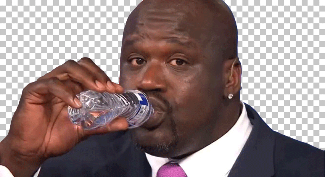 Shaquille O'Neal drinking water from bottle.