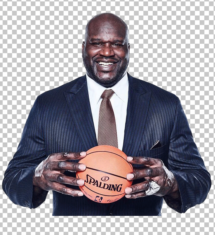 Shaquille O'Neal in suit holding a basketball.
