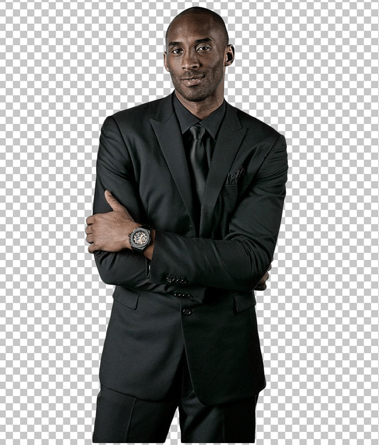 Kobe Bryant Standing in black suit.