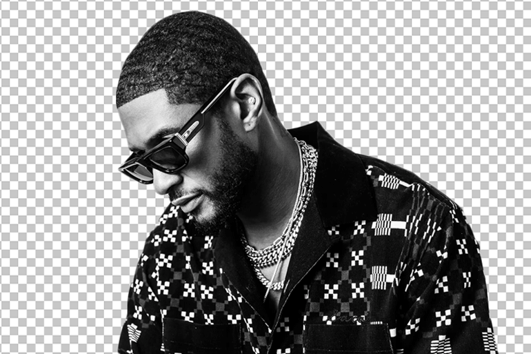 Usher Raymond is wearing sunglasses and looking down PNG Image.