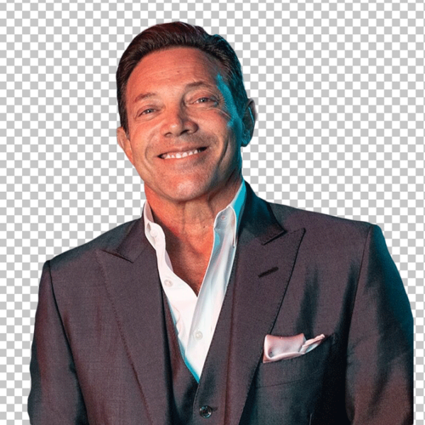 Jordan Belfort in a suit and white shirt, smiling PNG Image.