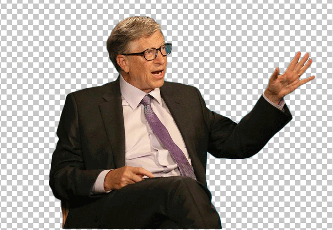 Bill Gates in a suit and tie, sitting in a chair with his hands raised in the air.