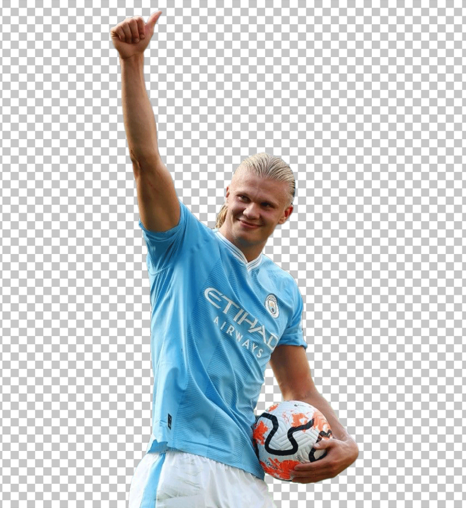 Manchester City FC football player Haaland holding a football with a thumbs-up gesture.