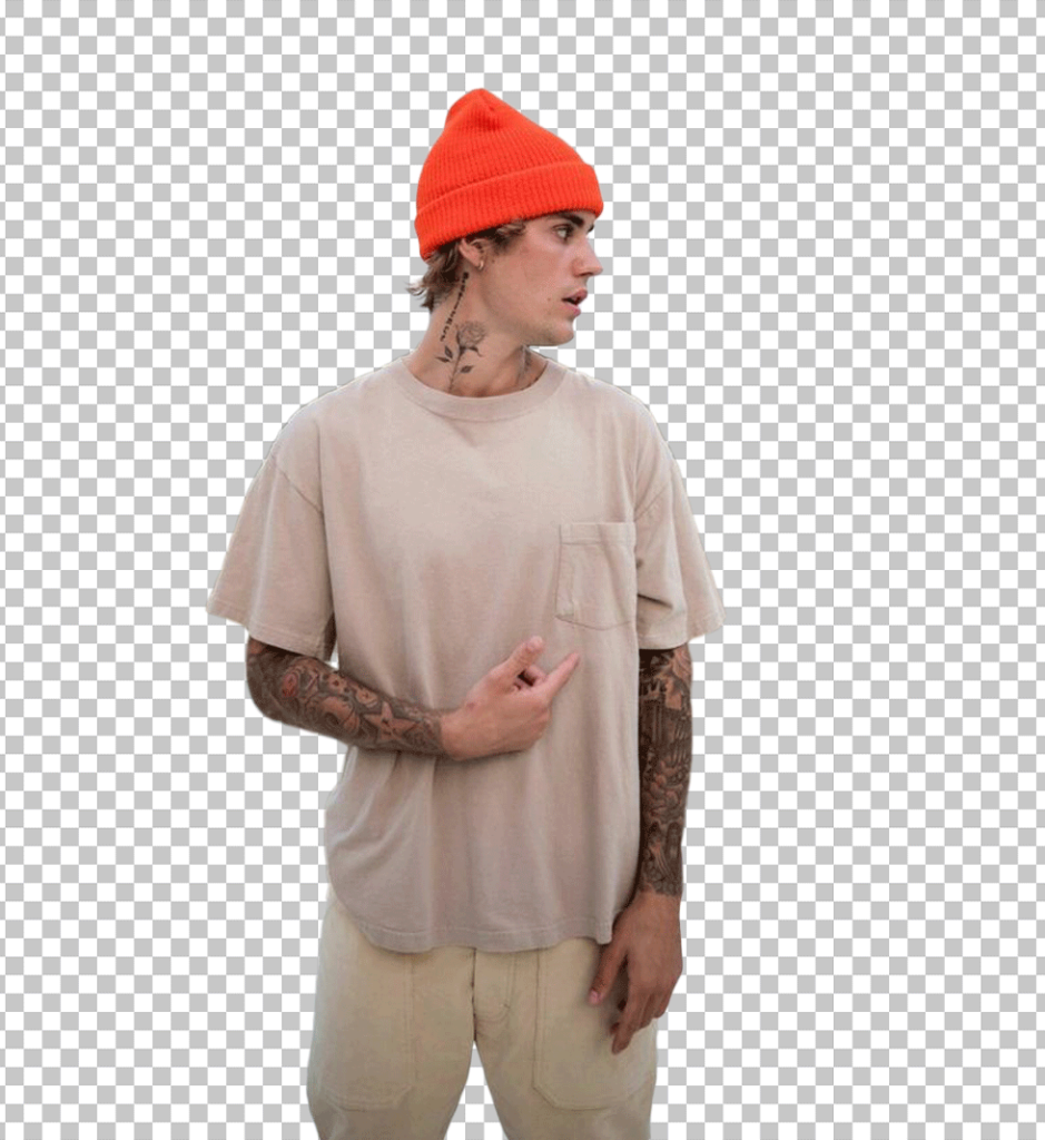 Justin Bieber is pointing and wearing an orange beanie PNG Image