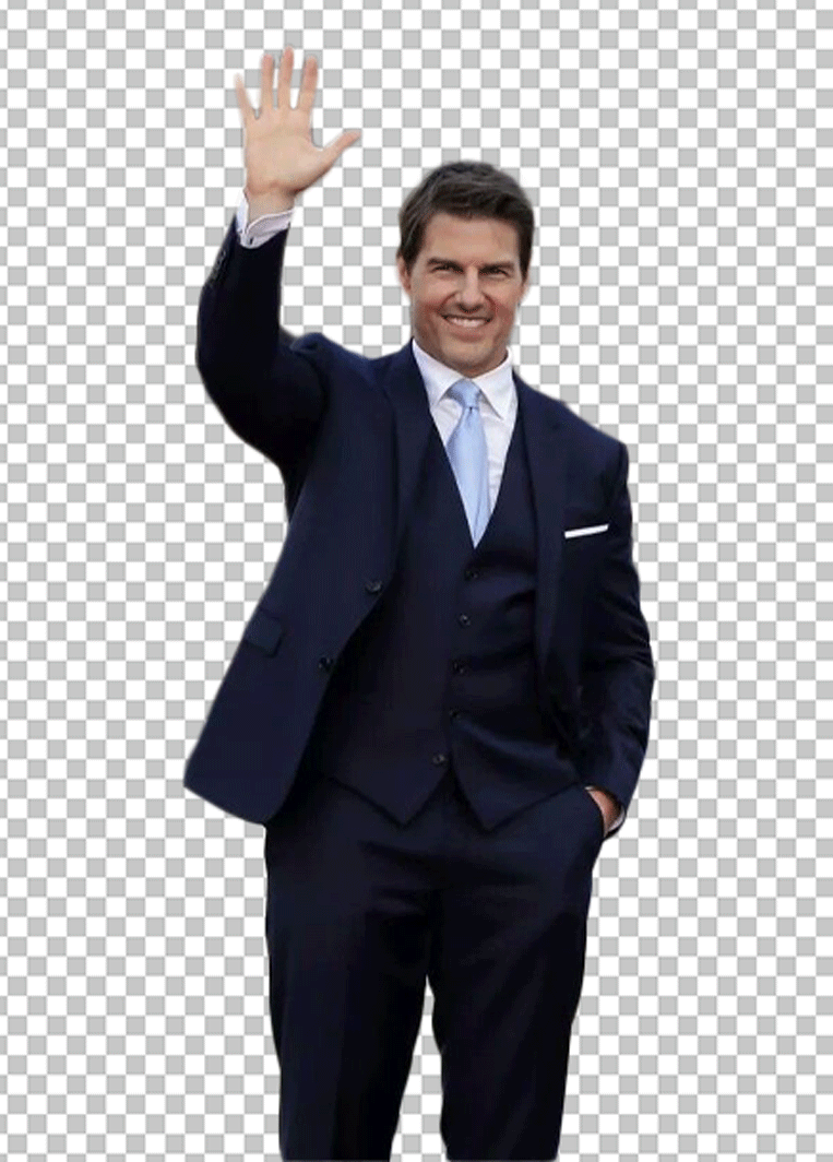 Tom Cruise is wearing a suit and waving.