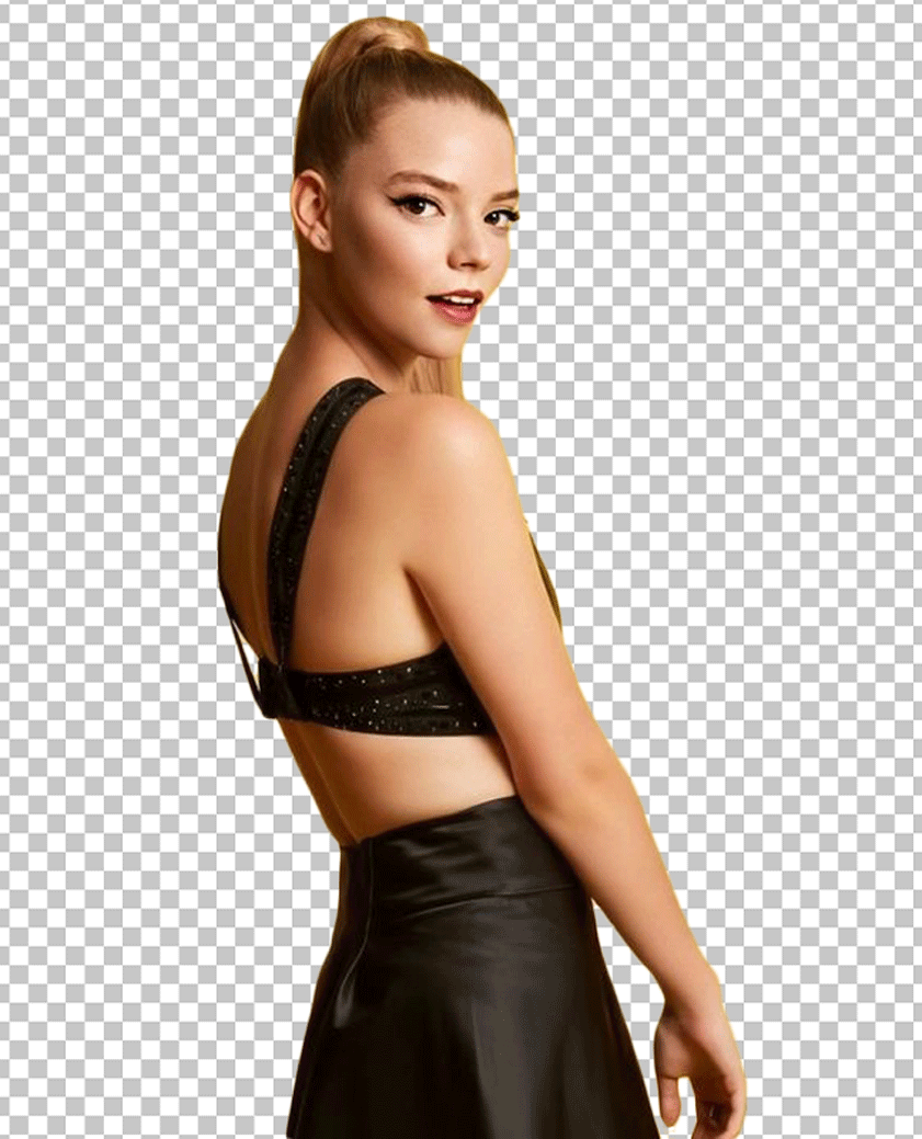 Anya Taylor-Joy side looks and is wearing a black dress.
