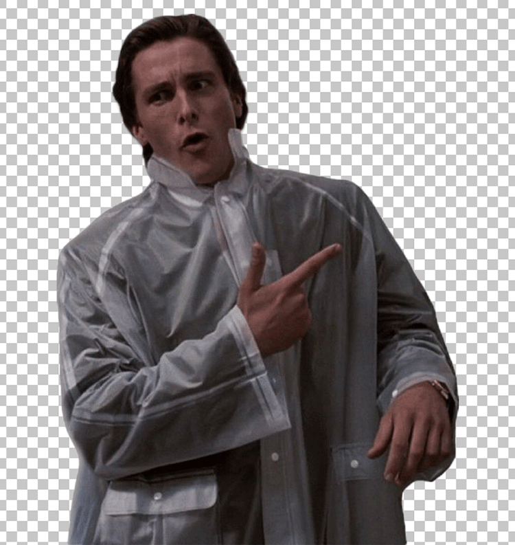 Christian Bale is wearing a white raincoat and pointing at something with his hand.