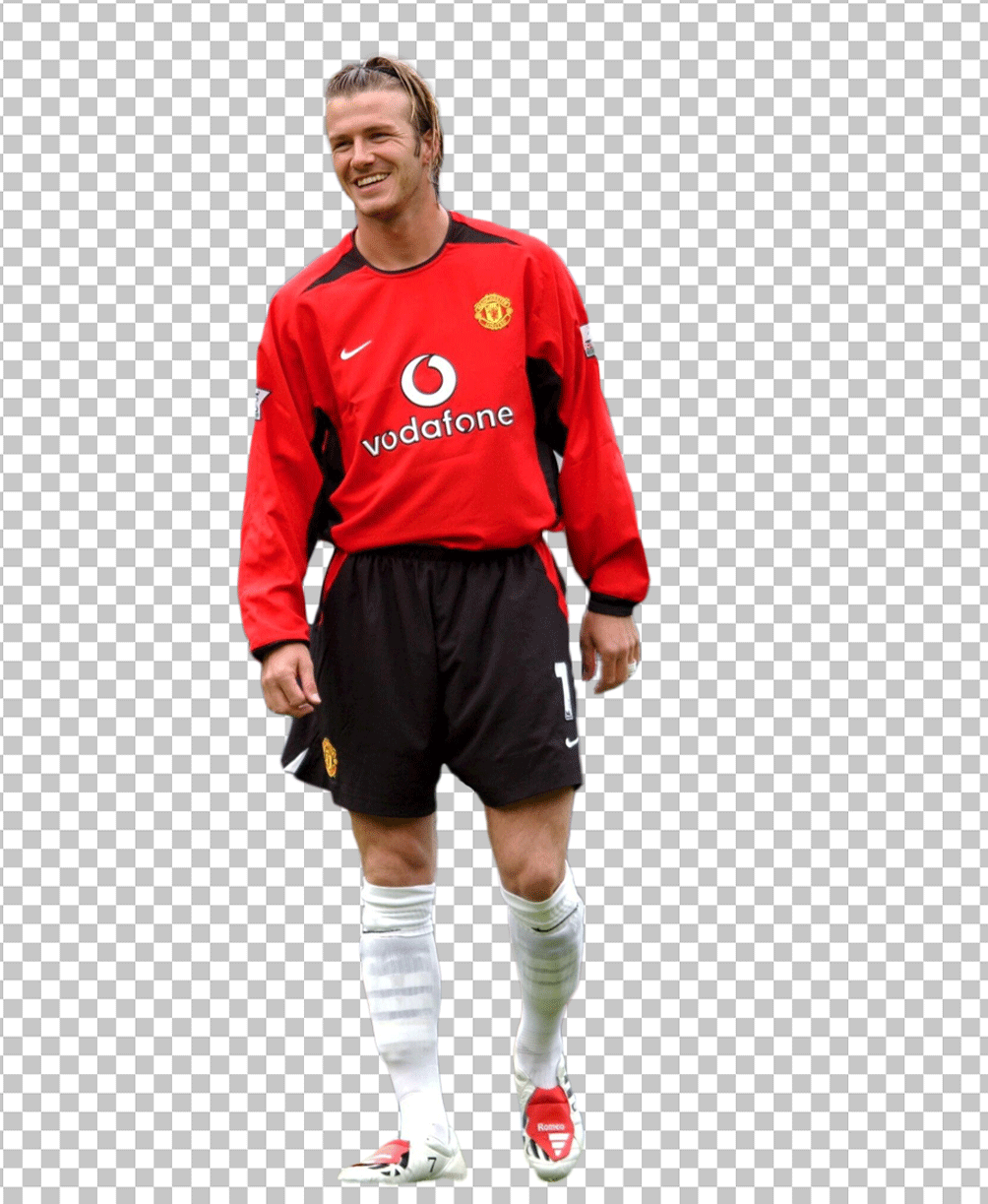 David Beckham walking in Manchester United's jersey.