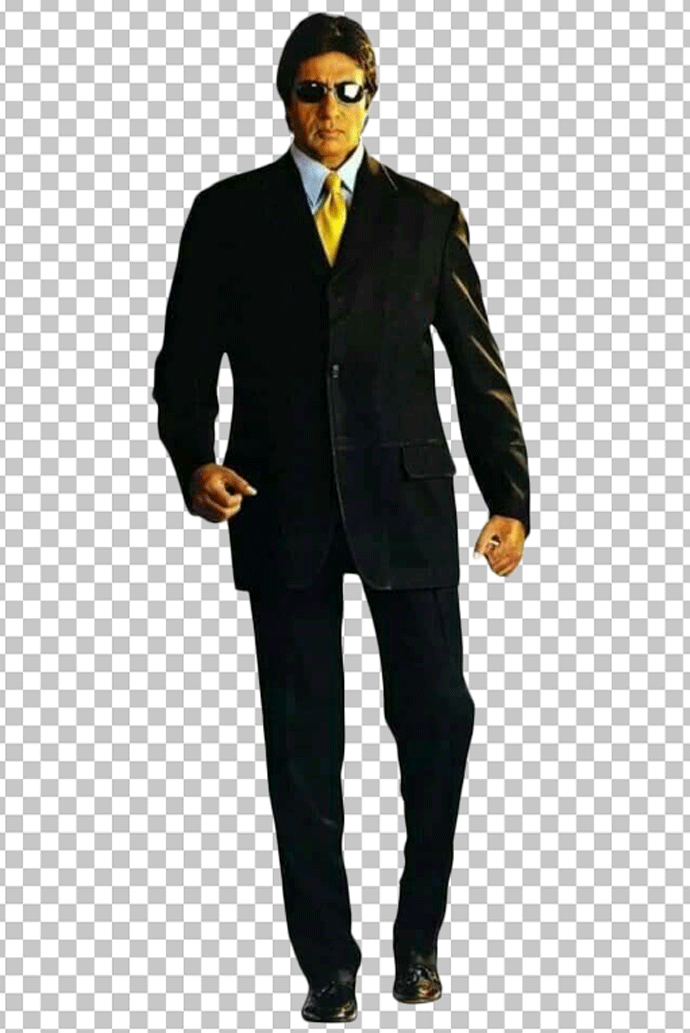Young Amitabh Bachchan is walking in a suit.