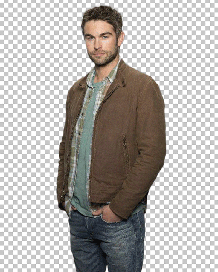 Chace Crawford is wearing a brown jacket and jeans, standing with his hands in his pockets.