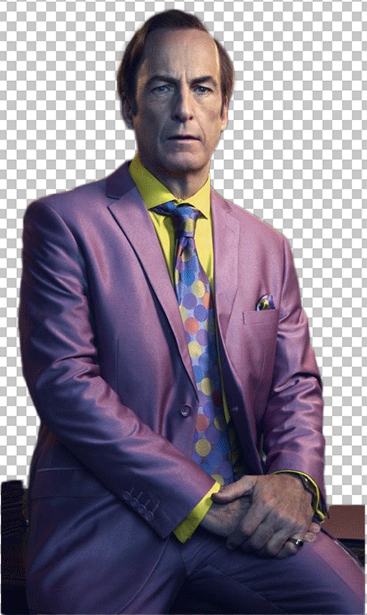 Saul Goodman in a purple suit and a yellow and blue striped tie sitting on a wooden chair.