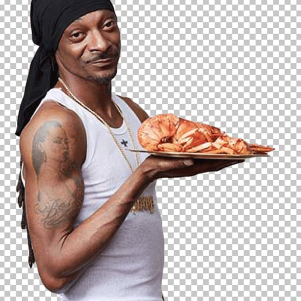 Snoop Dogg is holding a plate of prawns.