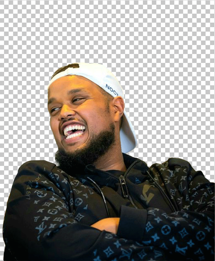 Chunkz is laughing and wearing a white cap.