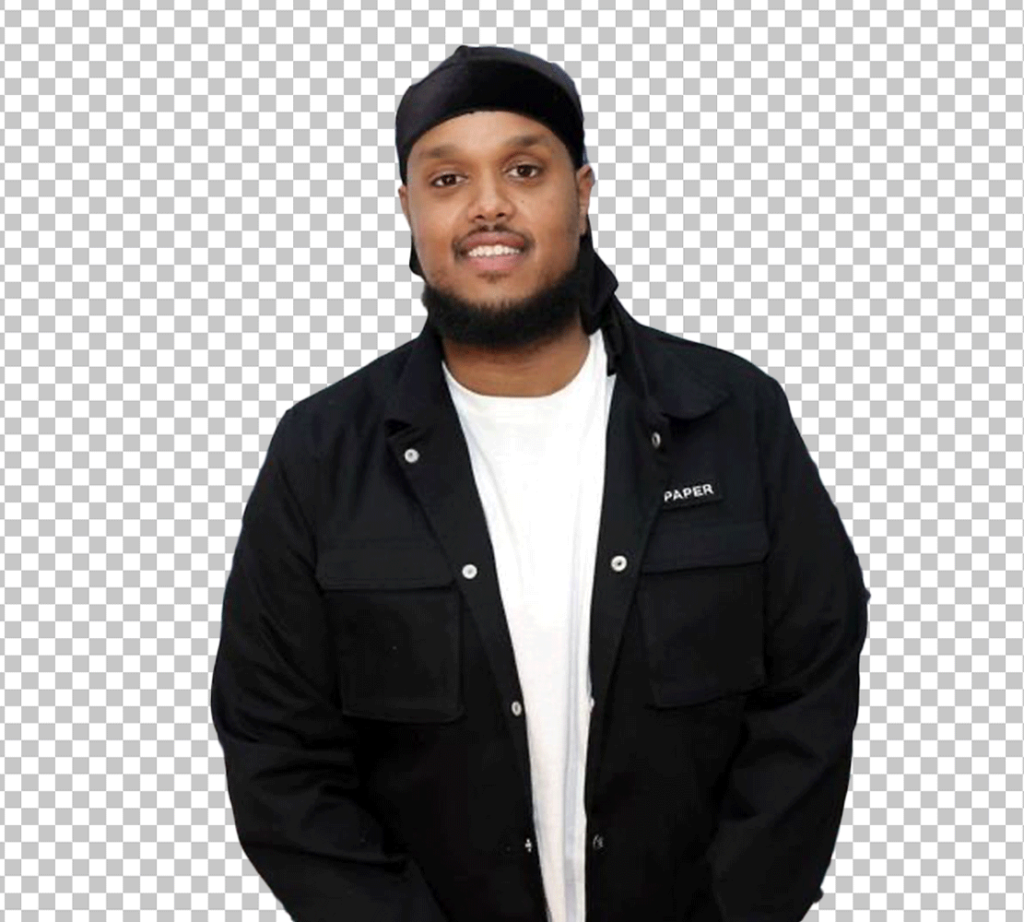 Chunkz is standing and wearing a durag and a black jacket.