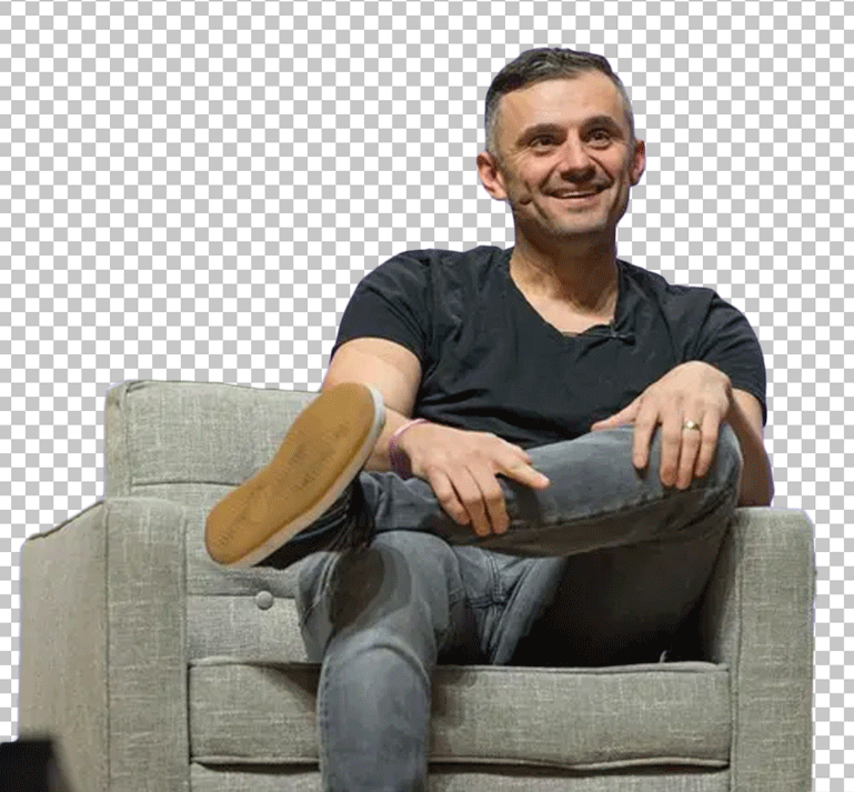 Gary Vee is sitting on a sofa PNG Image