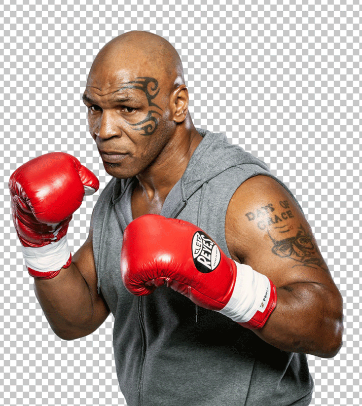 Mike Tyson is boxing and wearing red boxing gloves and a gray t-shirt.