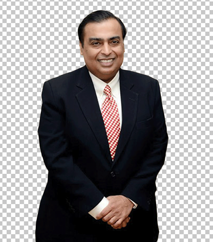 Mukesh Ambani is standing in a suit.