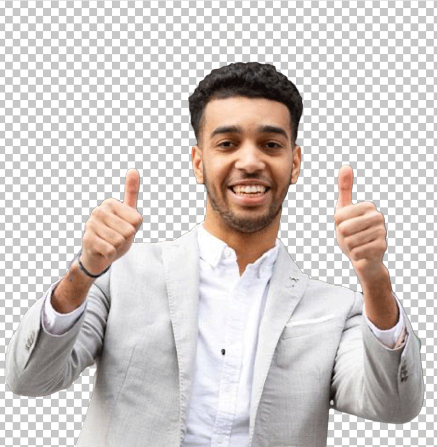 Niko Omilana in a suit making a thumbs up gesture with both hands.