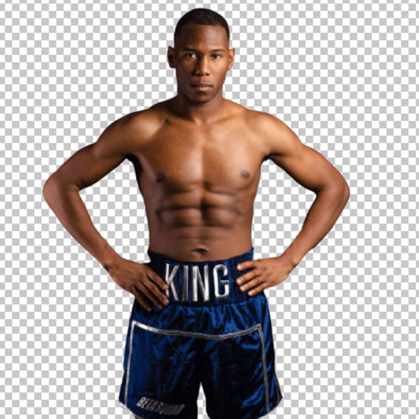 In a PNG image, King Kenny is standing wearing blue shorts.