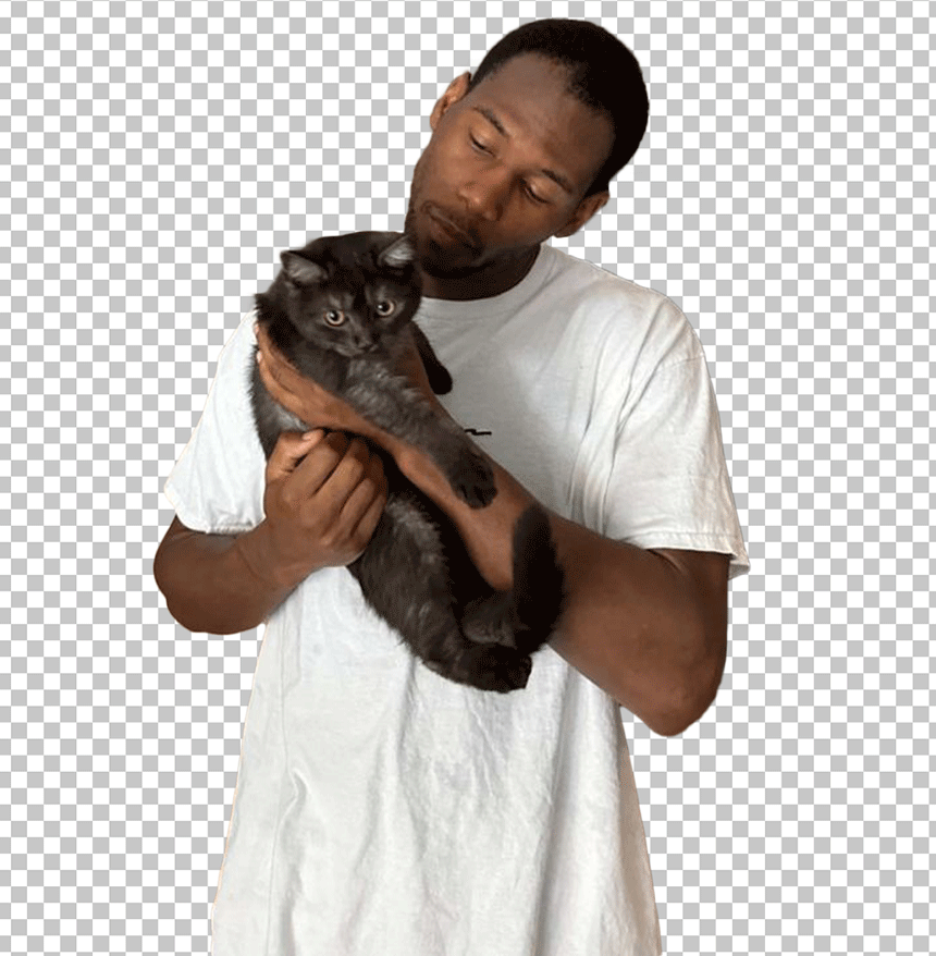 King Kenny is wearing a white t-shirt and holding a cat.