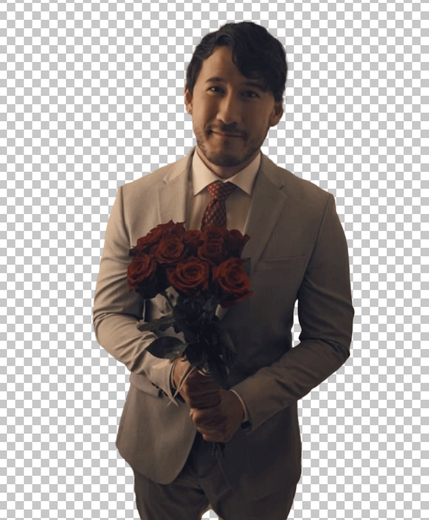 Markiplier is wearing a suit and holding a bouquet of roses.