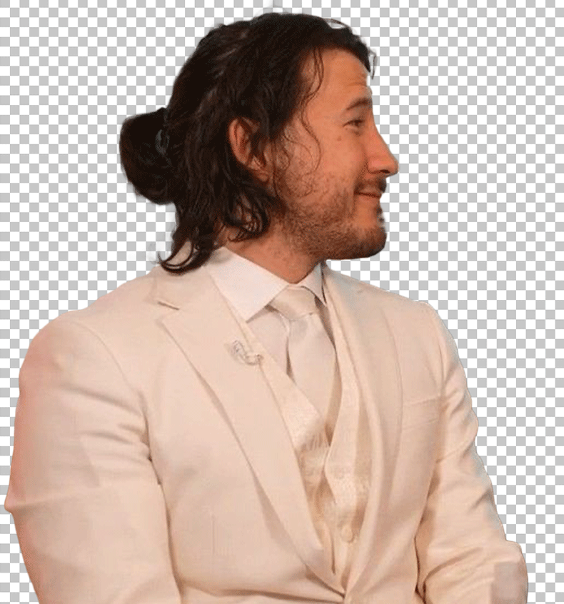 Markiplier is wearing a white suit and tie, with his hair pulled back into a ponytail.