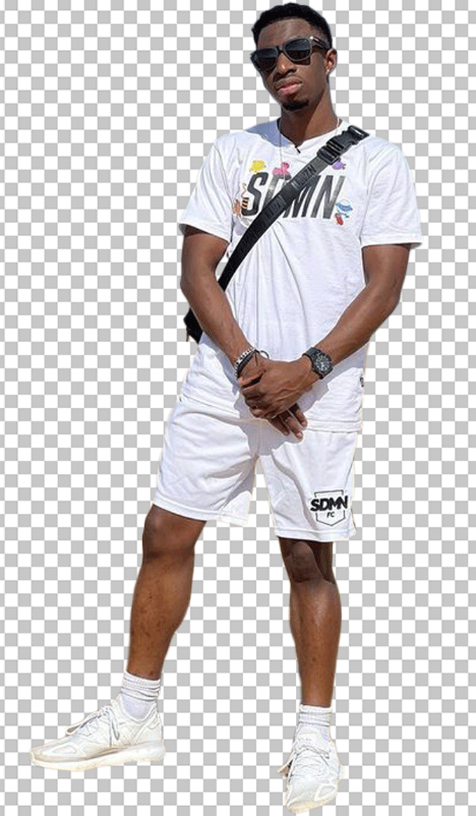 Tobi Brown standing in white shorts (PNG)