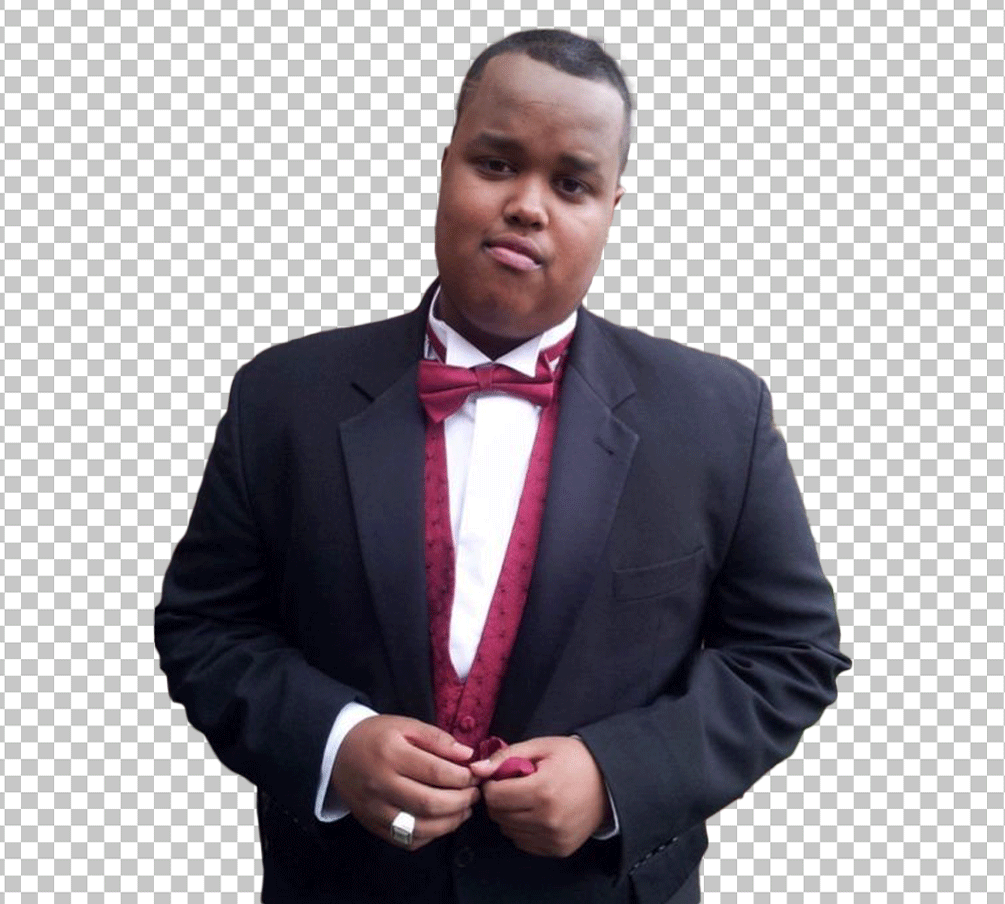 young Chunkz is wearing a black tuxedo with a red bow tie.
